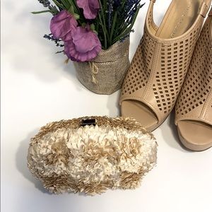 Nude flower fabric covered clutch bag.